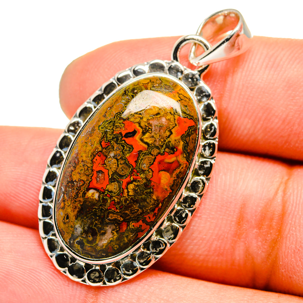 Sterling silver pendant with Moroccan agate cabochon, red and green patterned oval set.