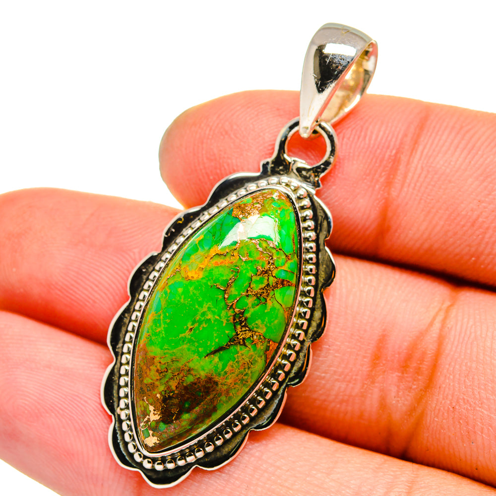 Green turquoise oval pendant with sterling silver ornate bezel and bail
