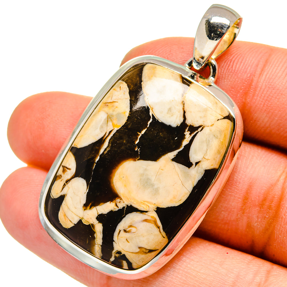 Sterling silver pendant with peanut wood jasper in dark and cream tones, polished cabochon