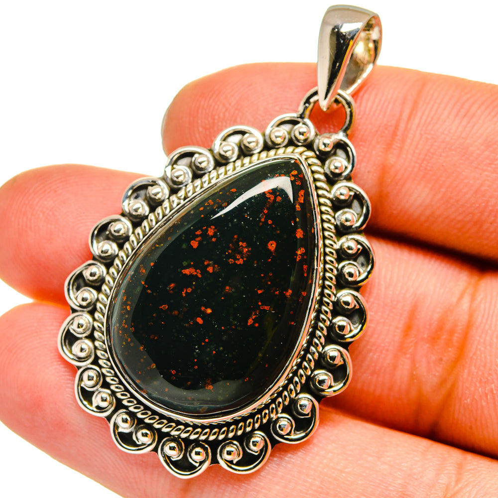 Bloodstone teardrop pendant in 925 sterling silver with dark green red speckle cabochon