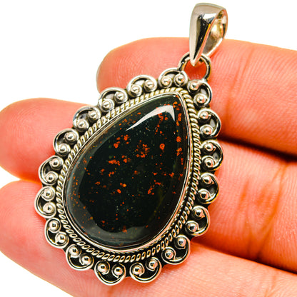 Bloodstone teardrop pendant in 925 sterling silver with dark green red speckle cabochon