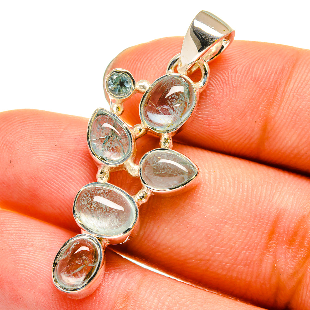 Sterling silver pendant with oval blue-green gemstone cluster and round bail