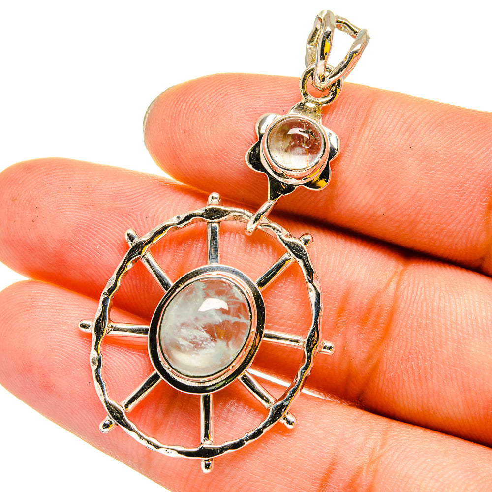 Aquamarine stone sterling silver pendant with circular sunburst frame
