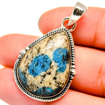 Sterling silver teardrop pendant with blue azurite stone and rope-edge bezel