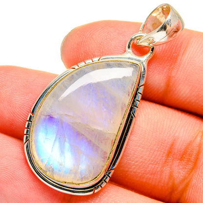 Oval rainbow moonstone pendant on silver chain loop, 925 sterling silver, close-up