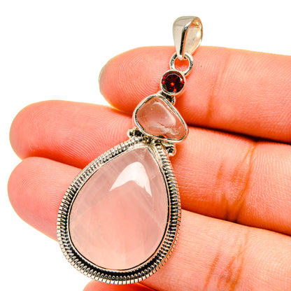 Sterling silver pendant with teardrop rose quartz and round garnet accents