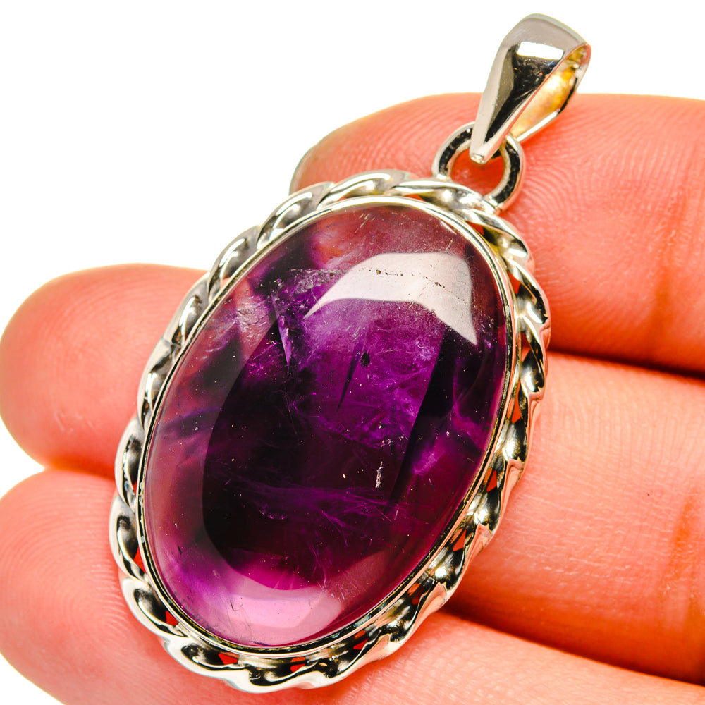 Sterling silver amethyst pendant with oval purple gemstone and loop bail