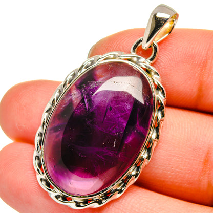 Sterling silver amethyst pendant with oval purple gemstone and loop bail