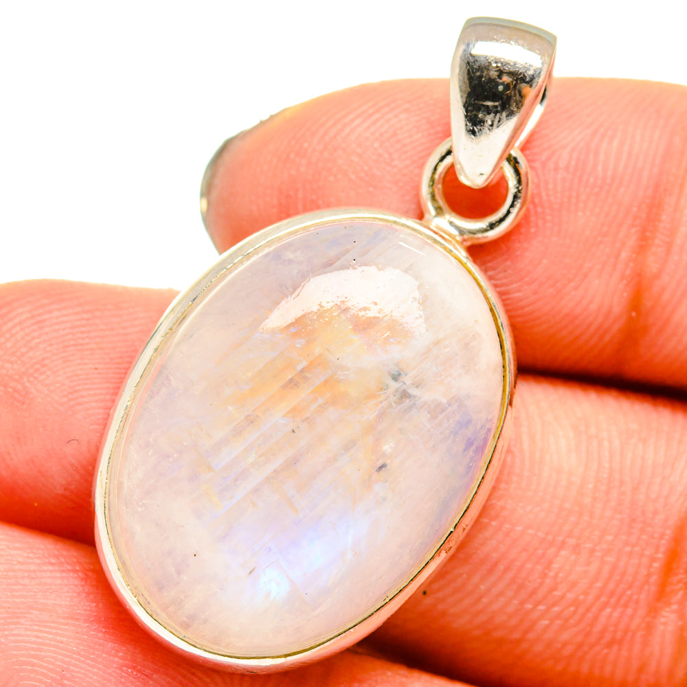 Iridescent moonstone pendant with sterling silver bezel and top bail, close-up