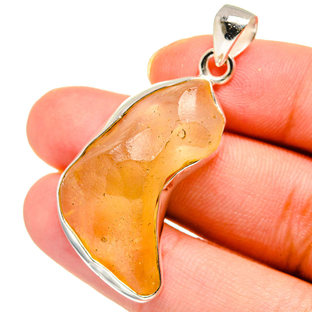 Sterling silver glass pendant with amber teardrop slice and open bail