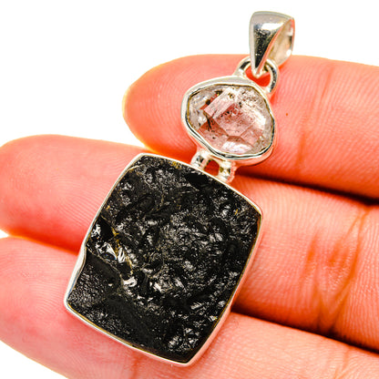 Sterling silver pendant with clear crystal bezel and dark rectangular tektite stone