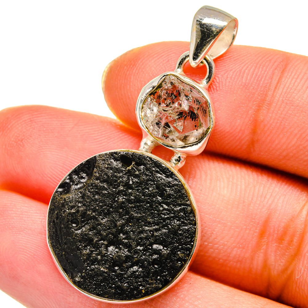 Silver pendant: round dark tektite disc with clear Herkimer diamond bezel