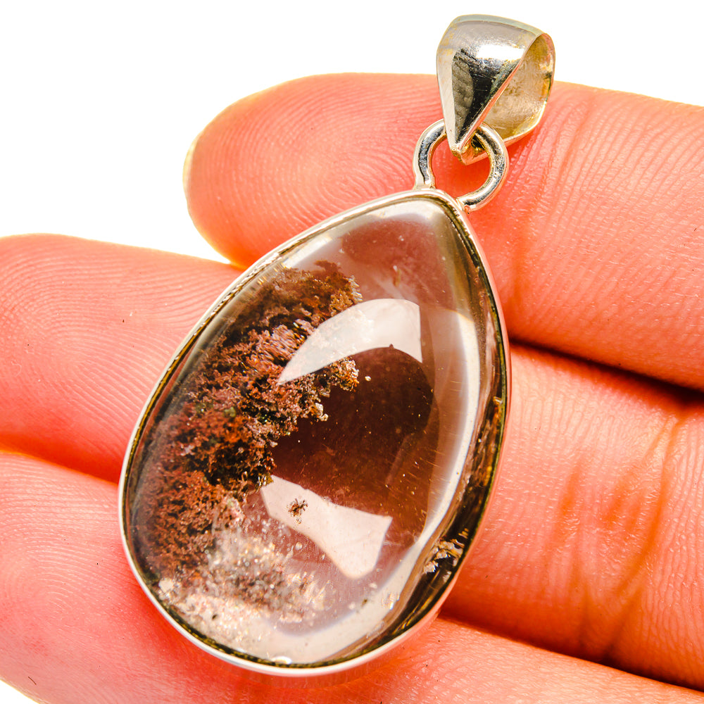 Teardrop quartz pendant with silver bail, brown-and-clear cabochon gemstone