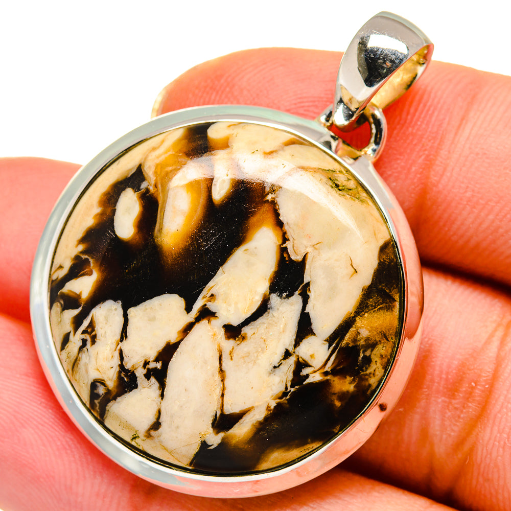 Sterling silver jasper pendant with round cabochon on gold-tone bail, amber and cream pattern