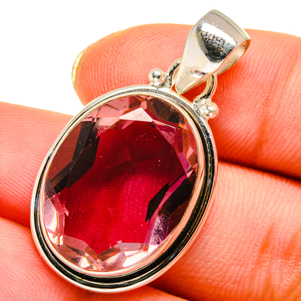 Oval alexandrite-style pendant with deep red gemstone and polished sterling bail
