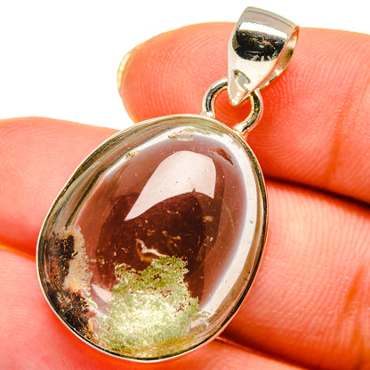 Oval garden quartz pendant with amber-brown center and green flecks, sterling silver