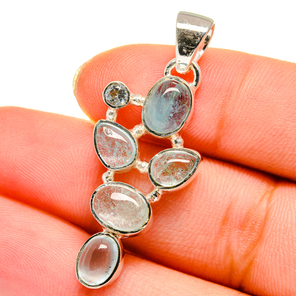 Oval gemstone pendant with 5 light-blue stones in sterling silver, round links and bail