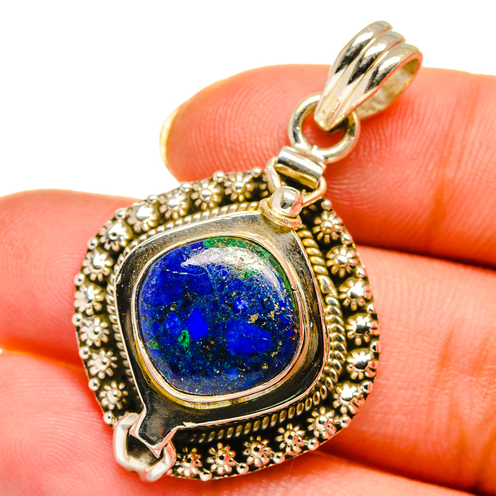 Sterling silver poison-style pendant with round blue gemstone and ornate beaded frame