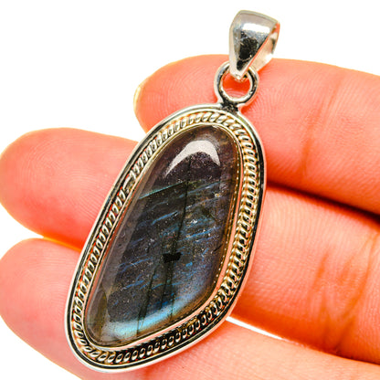 Labradorite pendant in sterling silver bezel, dark blue-green oval stone