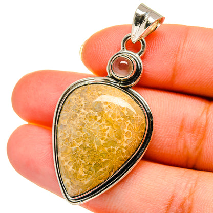 Teardrop pendant with yellow citrine cabochon and red coral accent, sterling silver bail