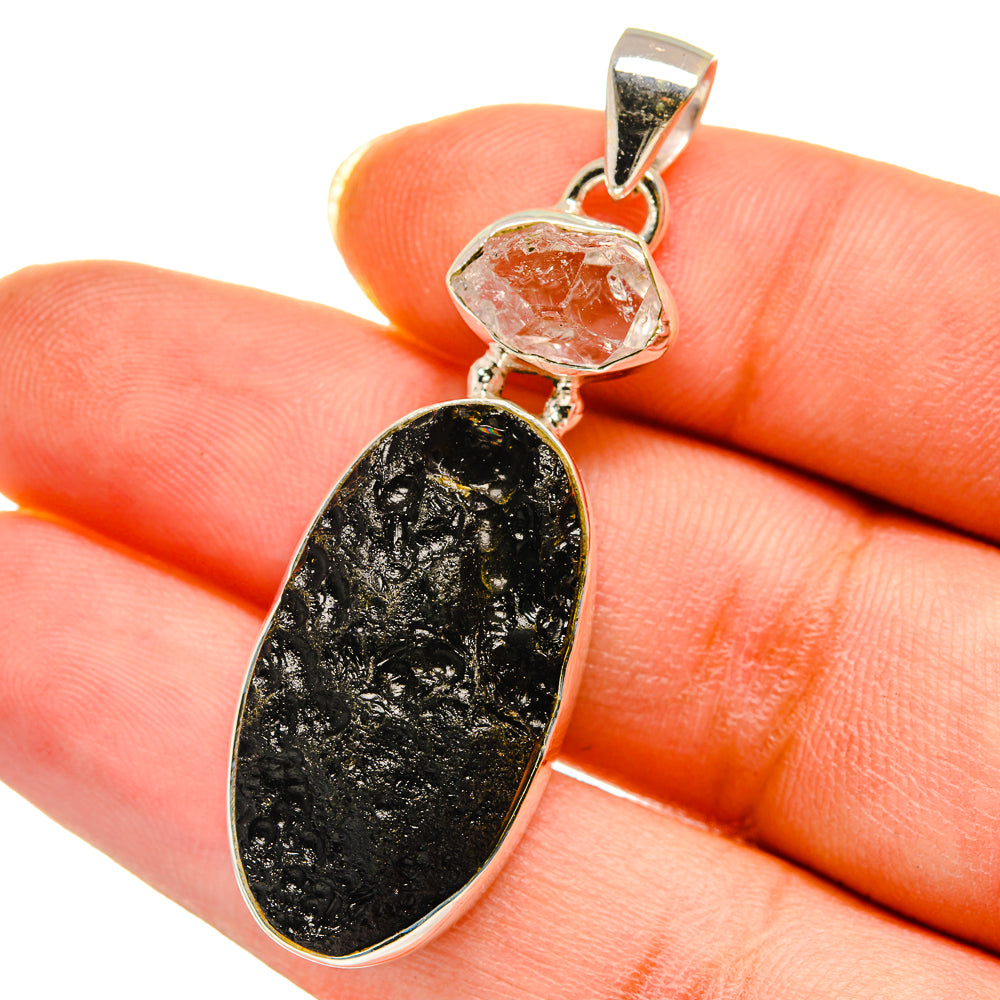 Sterling silver pendant with oval black druzy stone and clear crystal accent, top bail