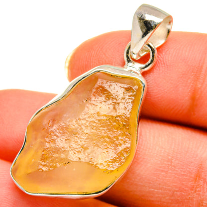 Libyan Desert Glass pendant in amber-yellow glass with sterling silver frame and loop