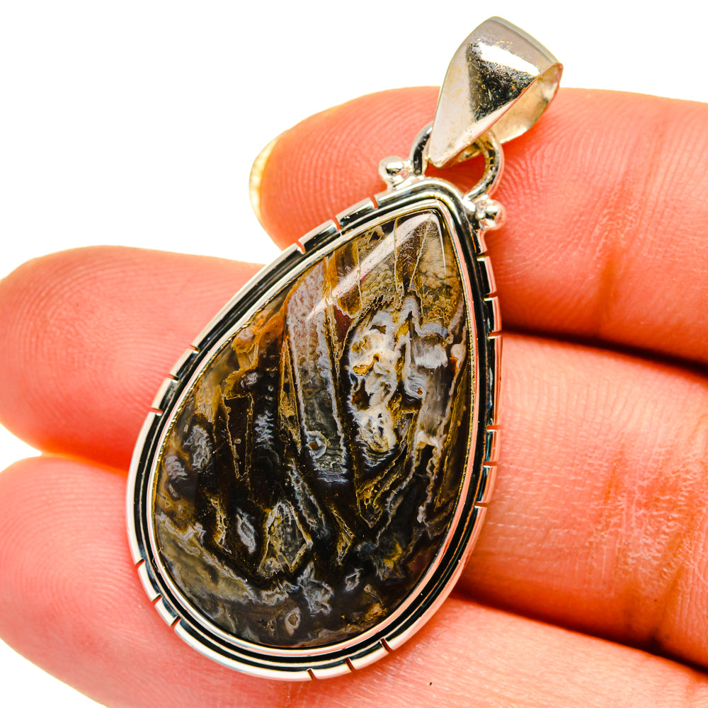 Teardrop agate pendant in 925 sterling silver, gold-toned bail, black and gold stone.