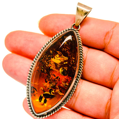 Amber teardrop pendant with 925 sterling silver frame and bail