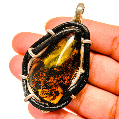 Sterling silver amber pendant with teardrop amber in black frame