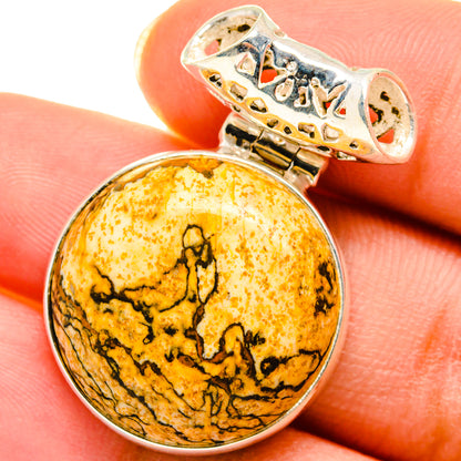 Oval amber jasper pendant with black web pattern, set in 925 silver and openwork bail