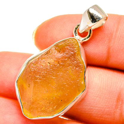 Teardrop Desert Glass pendant with silver bezel and loop bail, amber orange
