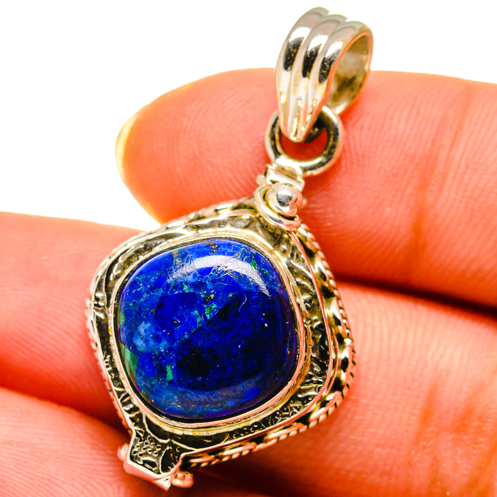 Oval blue stone pendant in ornate 925 sterling silver setting with bail