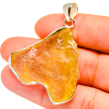 Orange Libyan desert glass pendant with sterling silver bezel and bail