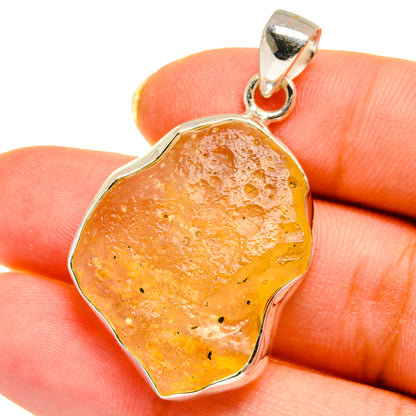Amber irregular desert glass pendant with sterling silver bail and scalloped bezel