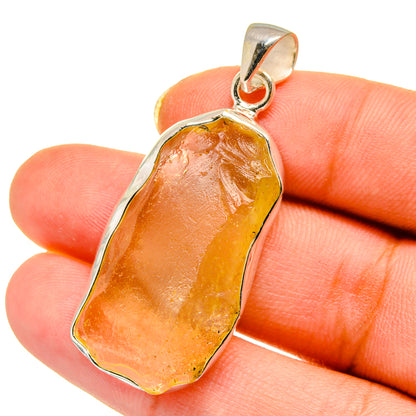 Irregular orange Libyan Desert Glass pendant with 925 sterling silver bail