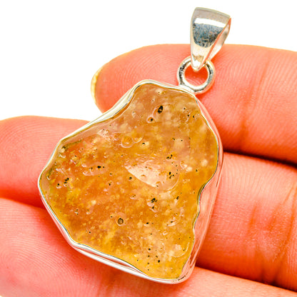 Amber speckled Libyan desert glass pendant in sterling silver bezel with bail