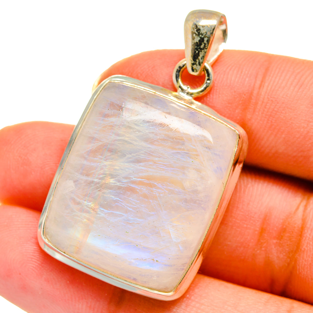 Square opalescent moonstone pendant with silver-toned bezel and gold-toned bail