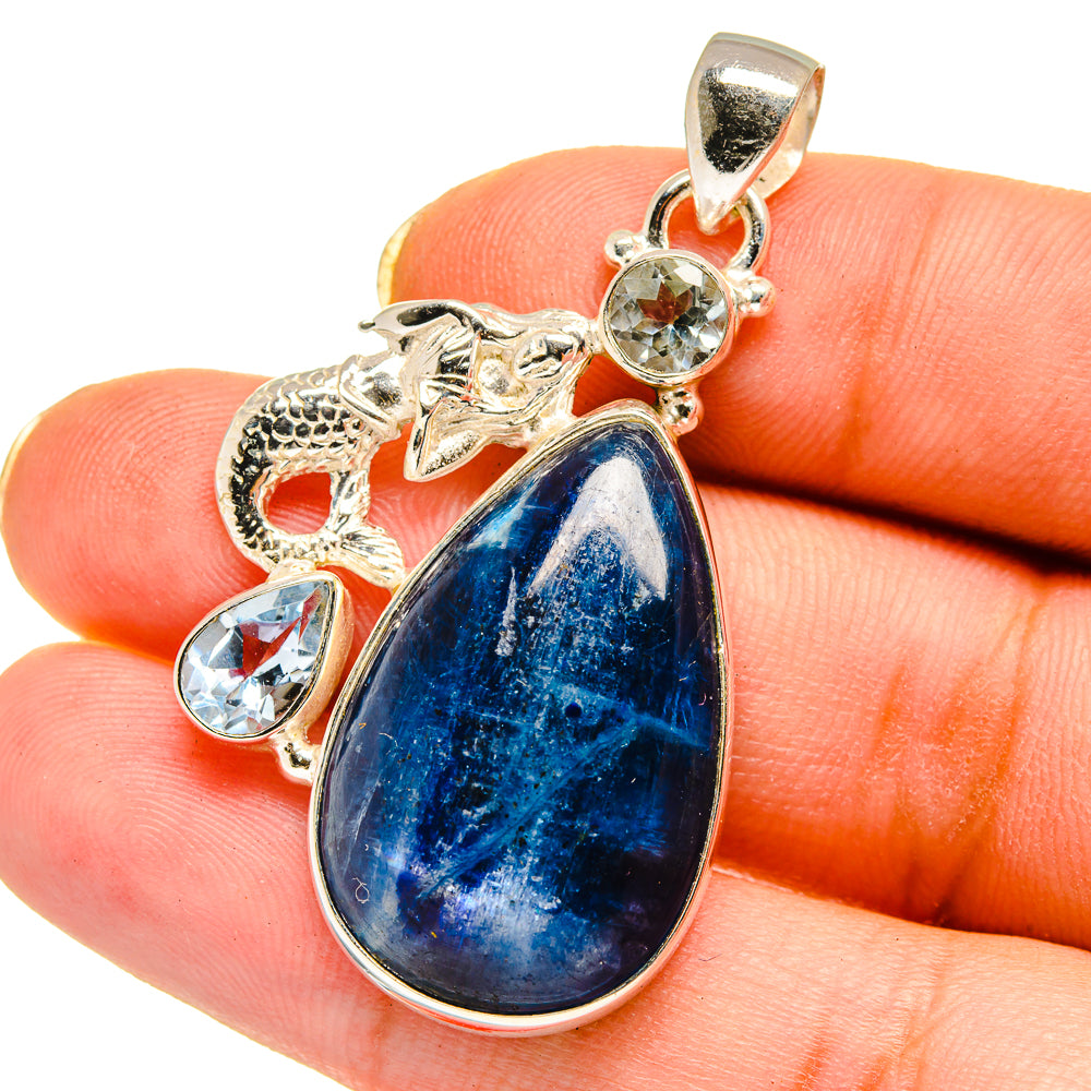 Mermaid pendant with blue teardrop gemstone, silver bail, and round crystal accents