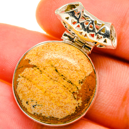 Round picture jasper cabochon pendant with sterling silver bezel and patterned bail