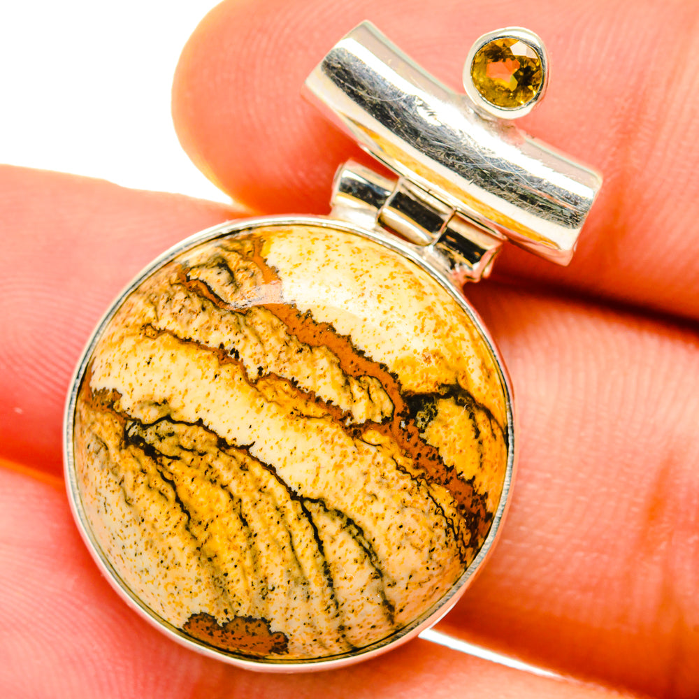 Sterling silver pendant with round picture jasper cabochon and citrine accent bail