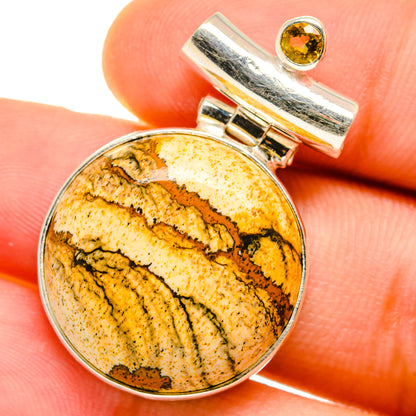 Sterling silver pendant with round picture jasper cabochon and citrine accent bail