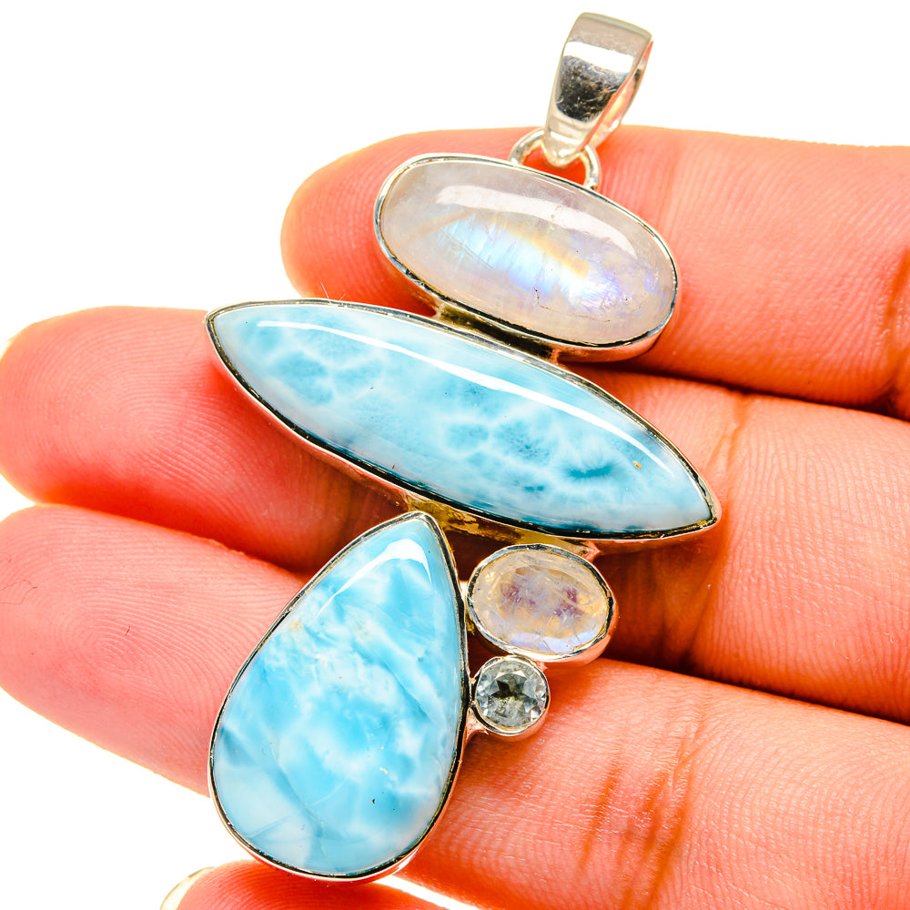 925 silver pendant close-up with oval blue cabochons, moonstone-style center, top bail