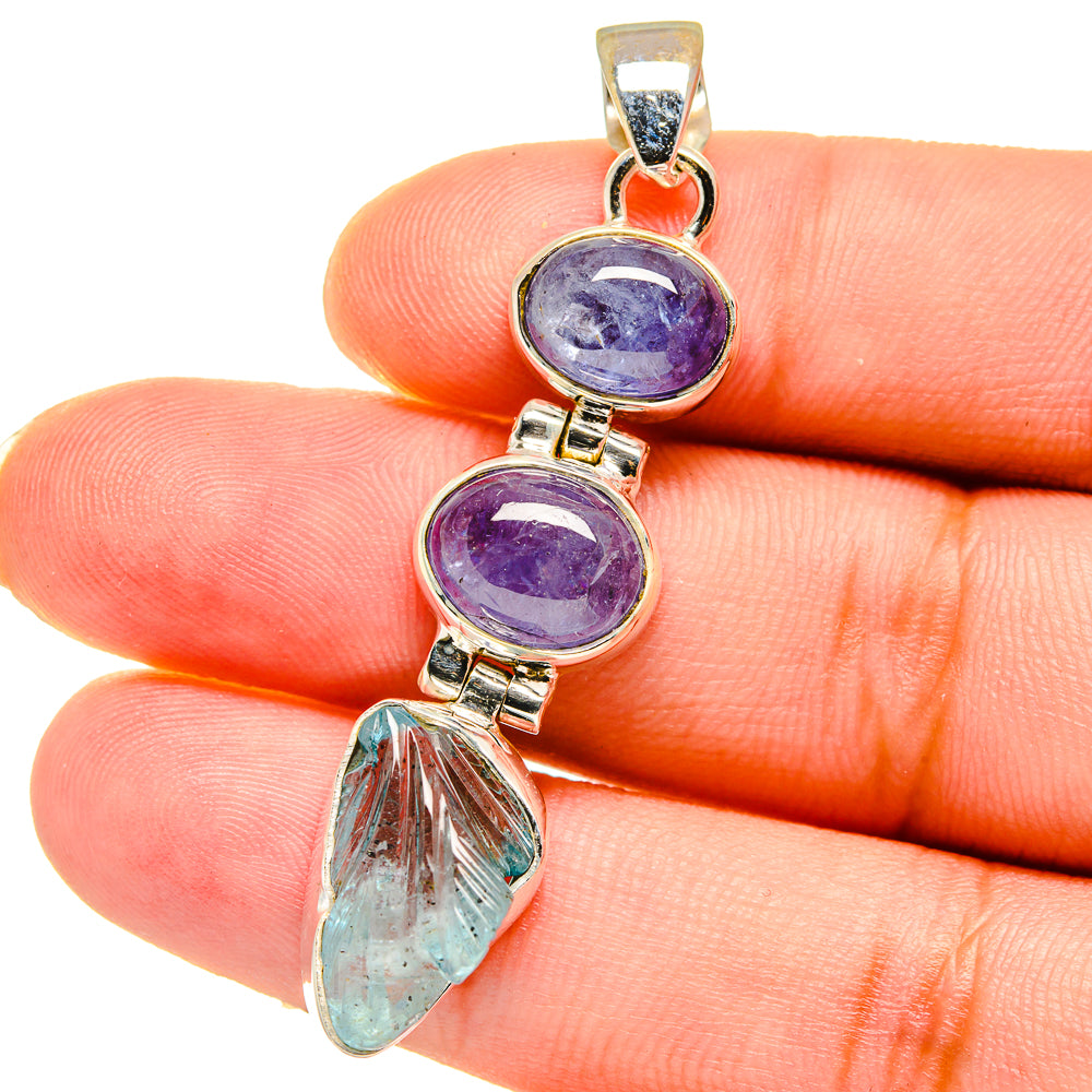 Sterling silver pendant with two purple oval stones and light blue teardrop stone