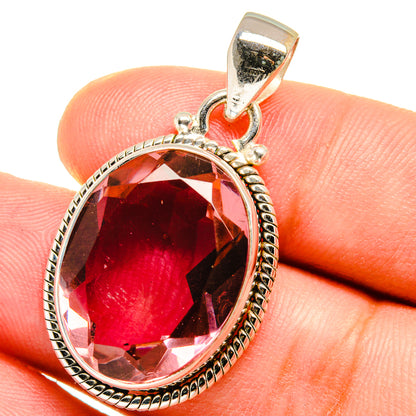 925 sterling silver oval pendant with faceted dark red gemstone and textured bezel