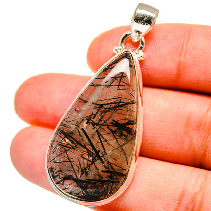 Teardrop sterling silver pendant with gold and black tourmalinated quartz core