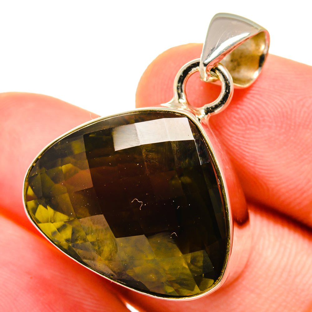 Teardrop quartz pendant with silver loop bail and olive green stone