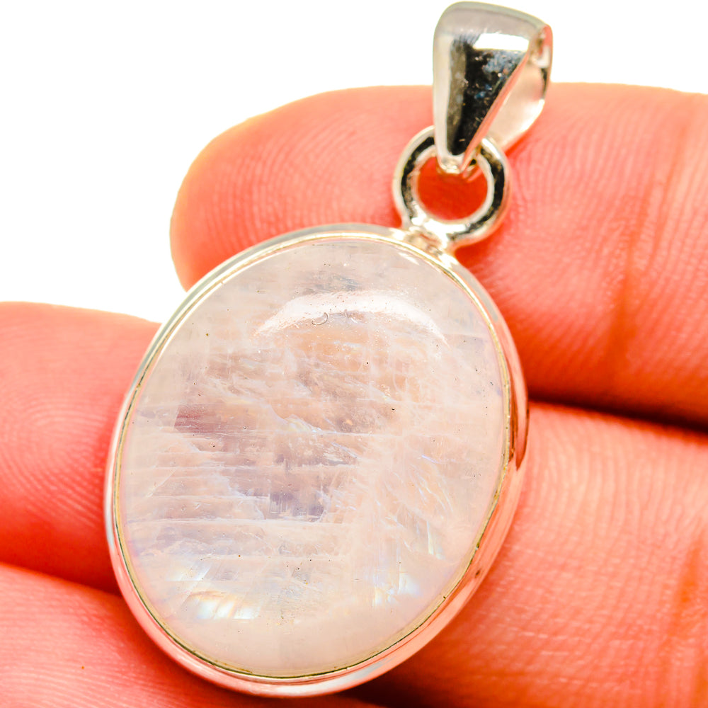 Oval moonstone pendant with sterling silver bail, front view with iridescent sheen