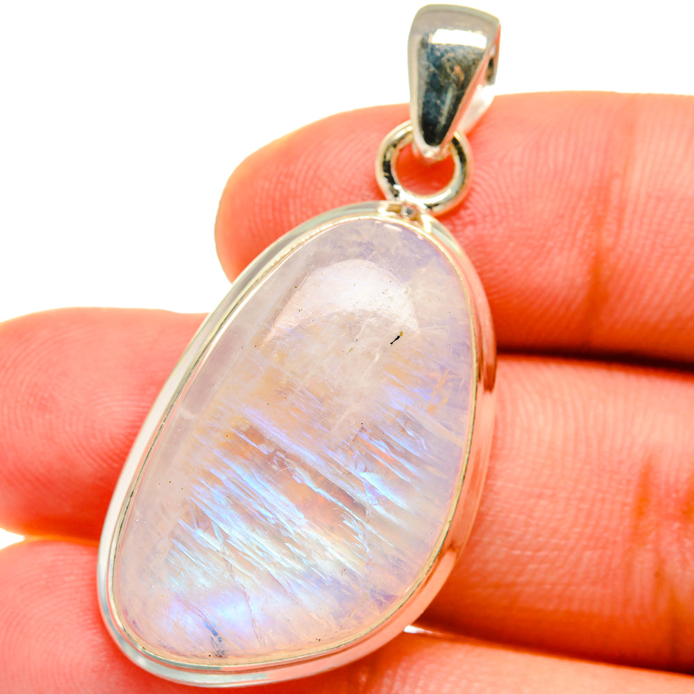 Oval rainbow moonstone pendant in polished 925 sterling silver bezel