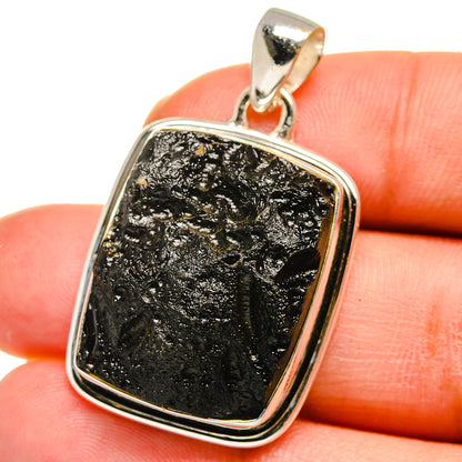 Square tektite pendant in sterling silver bezel, black textured stone, top loop bail
