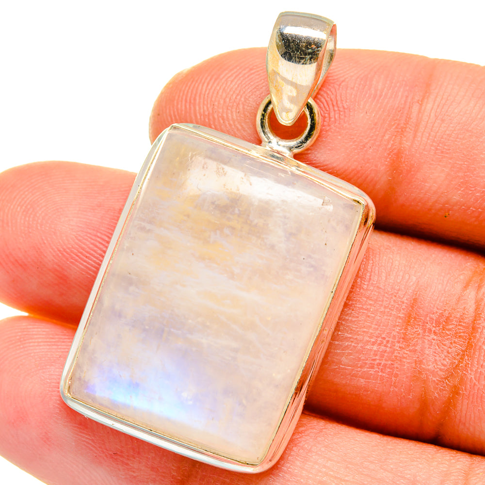 Square moonstone pendant on hand, 925 sterling silver frame and loop bail